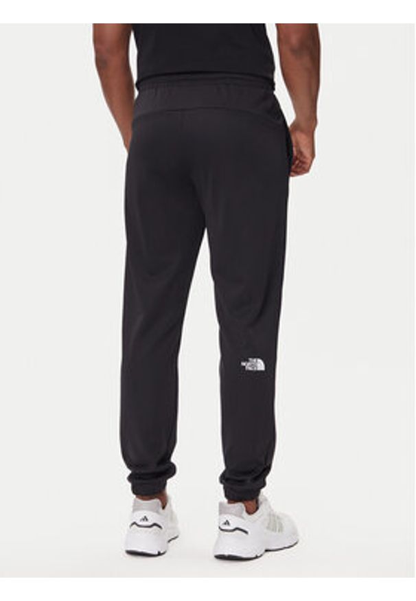 The North Face Spodnie dresowe Reaxion 2.0 NF0A8DRS Czarny Regular Fit. Kolor: czarny. Materiał: syntetyk