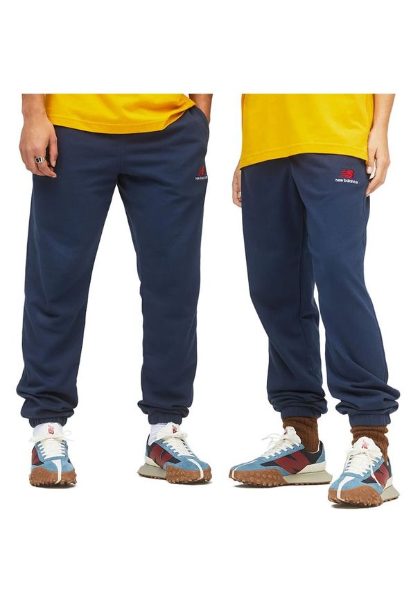 Spodnie New Balance UP21500NGO - granatowe. Kolor: niebieski. Materiał: materiał, dresówka. Sport: fitness