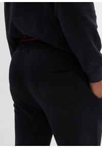 bonprix - Spodnie sportowe z czystej bawełny, ze sportowymi detalami. Kolor: czarny. Materiał: bawełna. Wzór: nadruk. Styl: sportowy #3