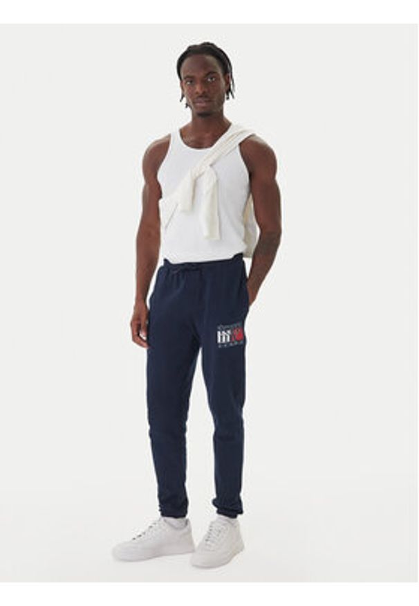 Tommy Jeans Spodnie dresowe DM0DM22094 Granatowy Relaxed Fit. Kolor: niebieski. Materiał: bawełna
