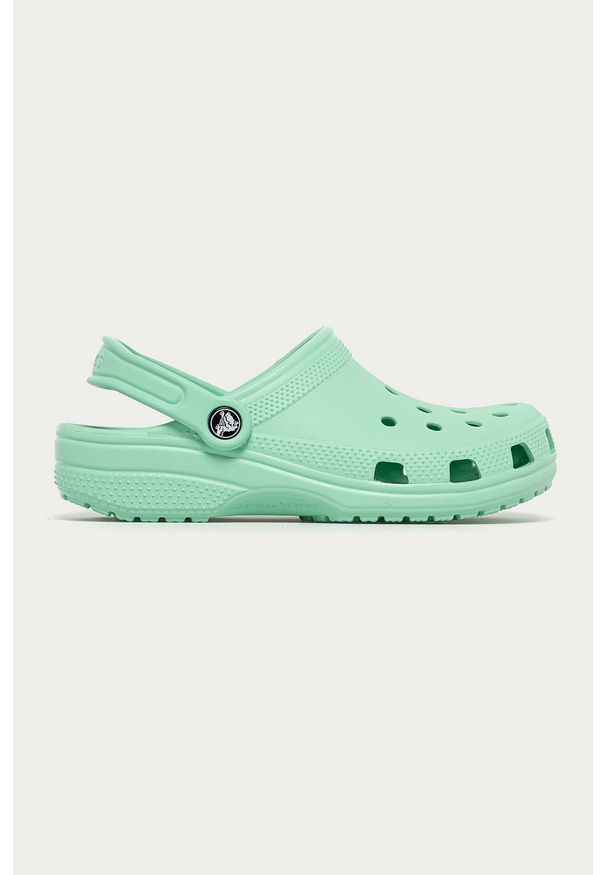 Crocs - Klapki dziecięce. Nosek buta: okrągły. Kolor: zielony. Materiał: syntetyk, materiał. Wzór: gładki. Obcas: na obcasie. Wysokość obcasa: niski