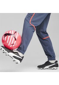 Buty piłkarskie Puma King Top FG/AG. Kolor: czarny, biały, żółty, wielokolorowy. Sport: piłka nożna