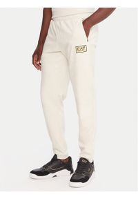 EA7 Emporio Armani Spodnie dresowe 7M000676 AF16718 U1086 Beżowy Regular Fit. Kolor: beżowy. Materiał: syntetyk #1