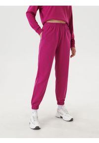 Sinsay - Spodnie dresowe jogger - różowy. Kolor: różowy. Materiał: dresówka