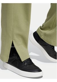 Adidas - adidas Spodnie dresowe Signature Graphic JI6524 Zielony Loose Fit. Kolor: zielony. Materiał: bawełna