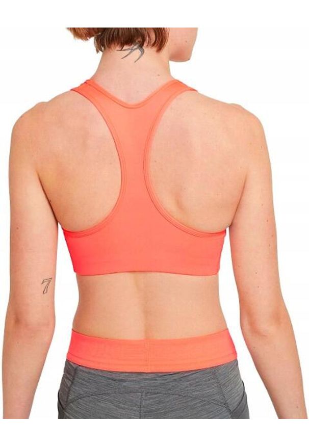 Stanik Sportowy damki Nike Nike Top treningowy. Kolor: pomarańczowy. Sport: fitness