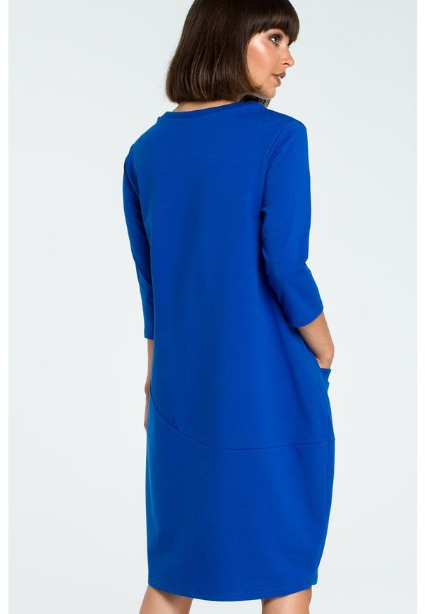 Sukienki.shop - Sukienka dresowa bombka oversize z kieszonką z przodu niebieska. Okazja: na co dzień. Kolor: niebieski, szary. Materiał: dresówka. Typ sukienki: bombki, oversize. Styl: casual