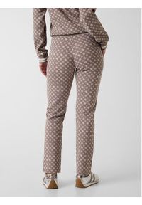 Guess Spodnie materiałowe 176829 Brązowy Slim Fit. Kolor: brązowy. Materiał: materiał #5