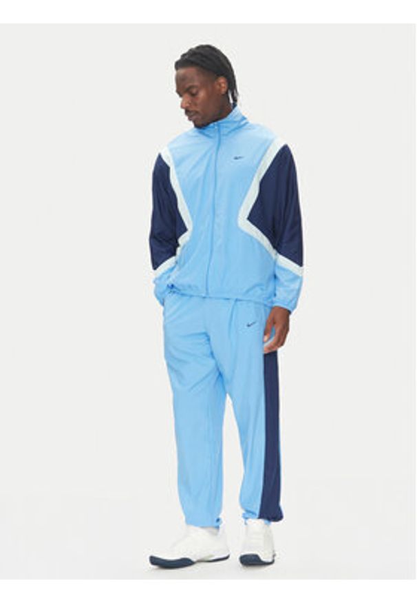 Nike Spodnie dresowe Icon FZ0250 Niebieski Relaxed Fit. Kolor: niebieski. Materiał: syntetyk