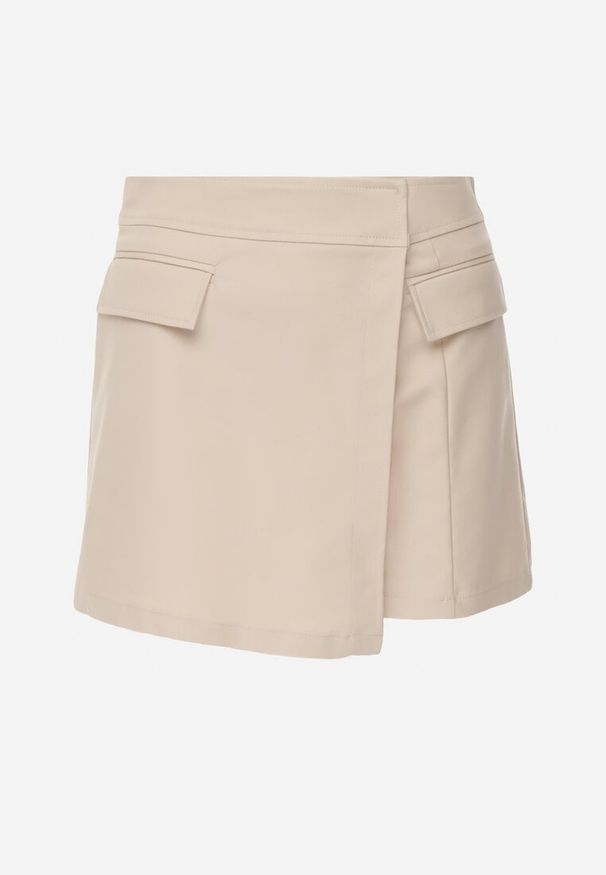 Renee - Beżowe Asymetryczne Spódnico-Szorty z Bawełną i Imitacją Kieszeni Tinabel. Kolor: beżowy. Materiał: bawełna. Wzór: aplikacja. Styl: elegancki