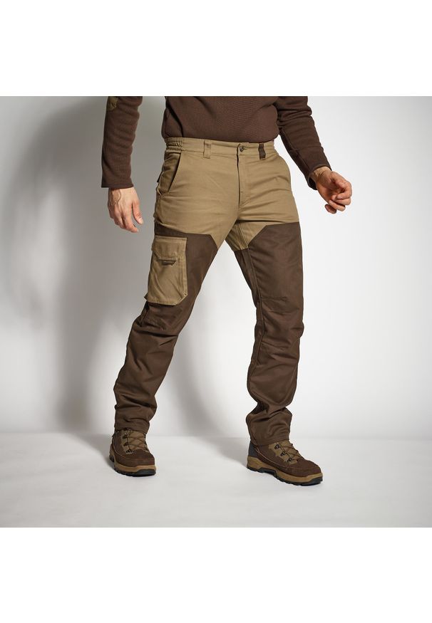SOLOGNAC - Spodnie outdoor Solognac Renfort 520. Kolor: brązowy. Materiał: materiał, bawełna, poliester. Sport: outdoor