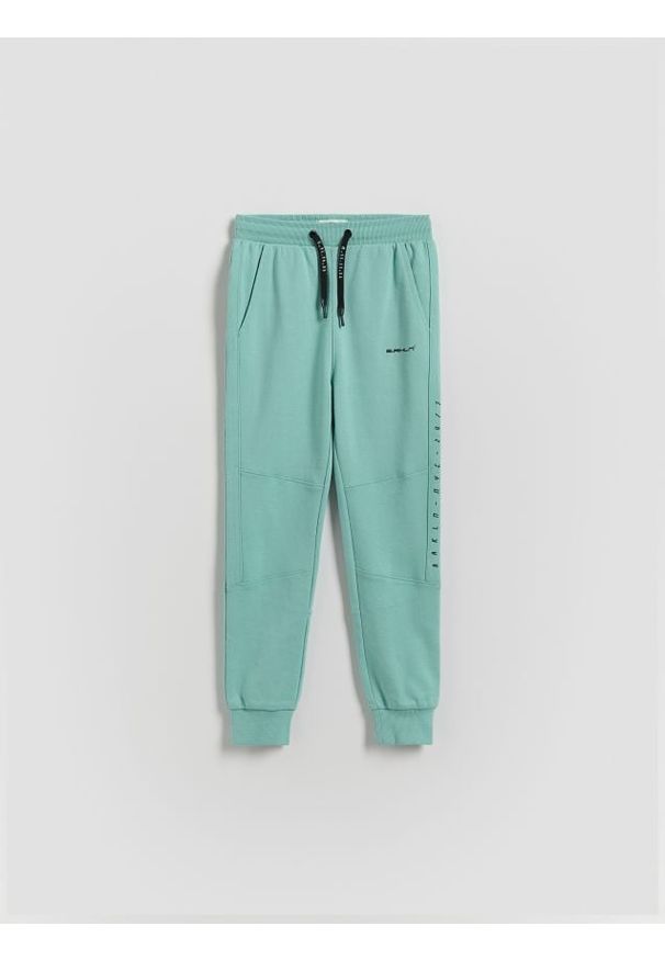Reserved - Bawełniane joggery - zielony. Kolor: zielony. Materiał: bawełna