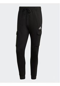 Adidas - adidas Spodnie dresowe Essentials Fleece Regular Tapered Cargo Joggers HL2226 Czarny Regular Fit. Kolor: czarny. Materiał: dresówka, bawełna