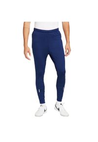 Nike - Męskie Spodnie Do Biegania Strike Winter Warrior ThermaFit. Kolor: niebieski. Materiał: dresówka