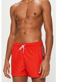 Calvin Klein - Szorty kąpielowe. Kolor: czerwony. Materiał: tkanina, poliester, materiał. Wzór: nadruk #1