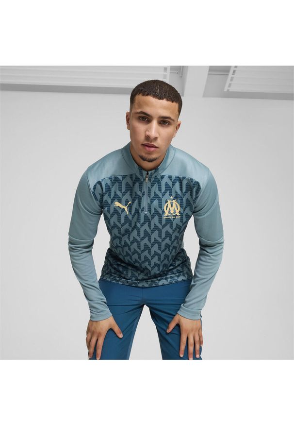 Puma - Męska bluza przedmeczowa z zamkiem 1/4 Olympique Marsylia PUMA. Kolor: niebieski. Długość rękawa: krótki rękaw. Długość: krótkie. Wzór: aplikacja. Sport: piłka nożna