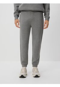 Reserved - Spodnie dresowe slim fit - jasnoszary. Kolor: szary. Materiał: dresówka