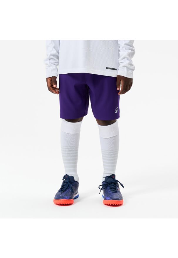 KIPSTA - Spodenki piłkarskie dla dzieci Kipsta Viralto Club. Kolor: fioletowy. Materiał: poliester, elastan, poliamid, materiał. Sezon: lato. Styl: sportowy