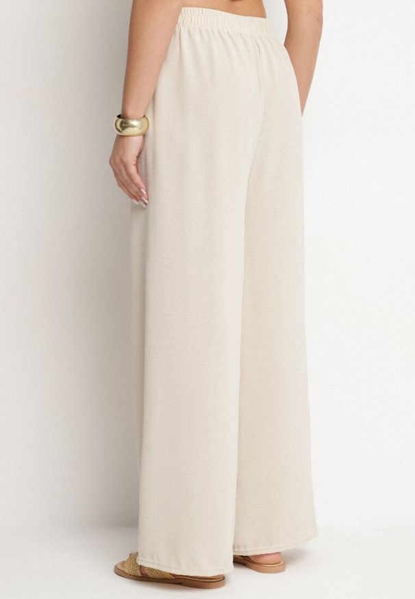 Born2be - Jasnobeżowe Szerokie Spodnie z Bawełną Ozdobione Wiązaniem Rosadira. Okazja: na co dzień. Kolor: beżowy. Materiał: bawełna. Wzór: aplikacja. Styl: klasyczny, casual