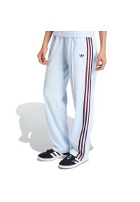 Adidas - Spodnie damskie adidas Originals Firebird Classic KC6561 - niebieskie. Kolor: niebieski. Materiał: tkanina, materiał, dresówka, poliester. Wzór: aplikacja, paski. Sezon: lato #1