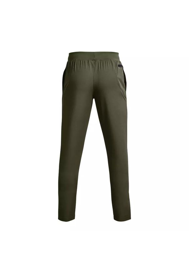 Spodnie dresowe męskie Under Armour UNSTOPPABLE TAPERED PANTS. Kolor: zielony. Materiał: dresówka