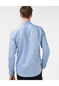Lacoste - LACOSTE - Elegancka niebieska koszula z logo Regular Fit. Kolor: niebieski. Materiał: jeans. Wzór: haft. Styl: elegancki #3