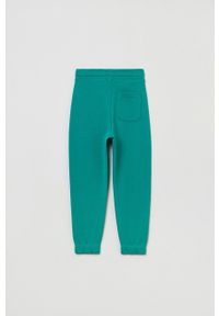 OVS spodnie dresowe dziecięce kolor zielony gładkie. Okazja: na co dzień. Kolor: zielony. Materiał: dresówka. Wzór: gładki. Styl: casual