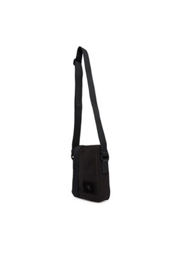 Calvin Klein Saszetka Canvas Mix Reporter LV04D3366G Czarny. Kolor: czarny. Materiał: materiał