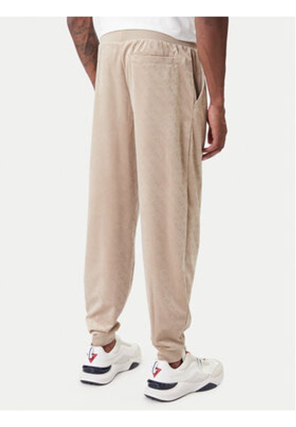 Guess Spodnie dresowe Z6RB14 KD612 Beżowy Regular Fit. Kolor: beżowy. Materiał: syntetyk