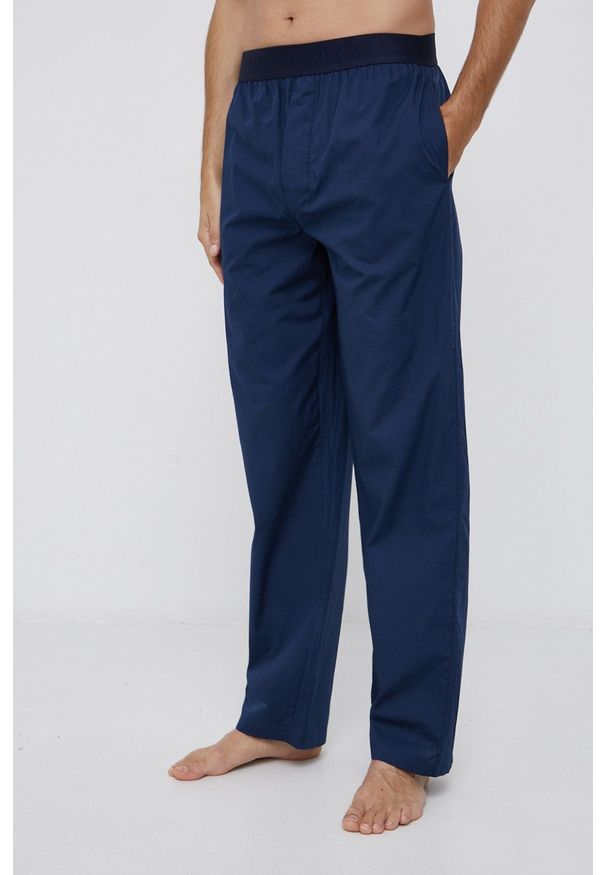 Resteröds Spodnie piżamowe męskie kolor granatowy gładkie. Kolor: niebieski. Materiał: tkanina. Wzór: gładki