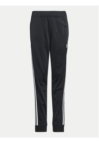 Adidas - adidas Spodnie dresowe adicolor SST IX7630 Czarny Regular Fit. Kolor: czarny. Materiał: syntetyk #3