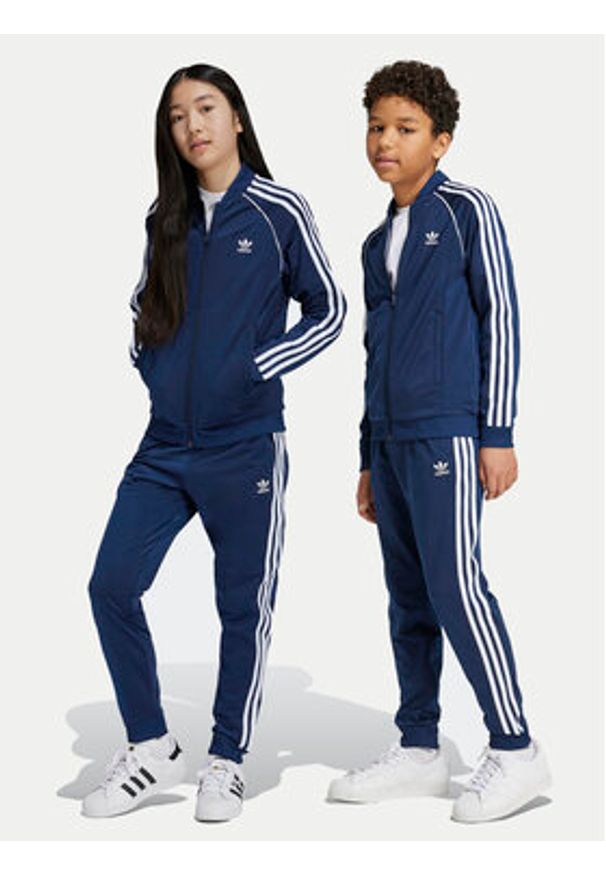 Adidas - adidas Spodnie dresowe adicolor SST IY7466 Granatowy Regular Fit. Kolor: niebieski. Materiał: syntetyk