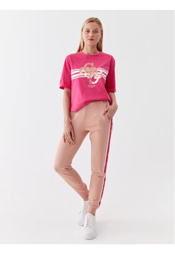 Guess Spodnie dresowe V3YB20 aKBV71 Brązowy Regular Fit. Kolor: brązowy. Materiał: dresówka, bawełna