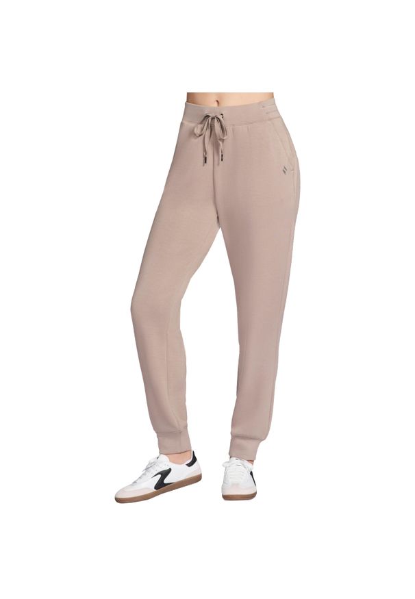 skechers - Spodnie sportowe damskie Skechluxe Elevate Jogger Pant. Kolor: beżowy. Materiał: poliester. Długość: długie