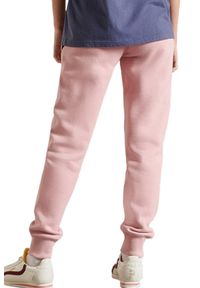 Spodnie dresowe damskie Superdry Pride In Craft joggery. Kolor: różowy. Materiał: bawełna, poliester