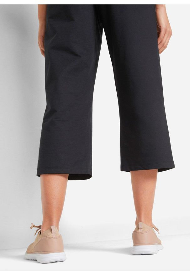 bonprix - Spodnie dresowe z bawełny organicznej, dł. do łydki. Kolor: czarny. Materiał: bawełna, dresówka