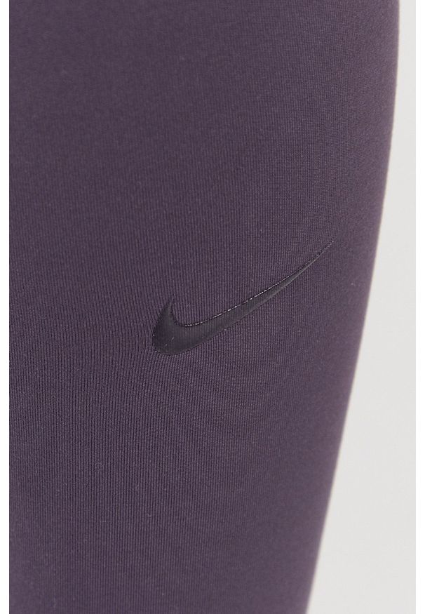 Nike - Legginsy. Kolor: fioletowy. Materiał: tkanina, dzianina, skóra, włókno. Technologia: Dri-Fit (Nike)