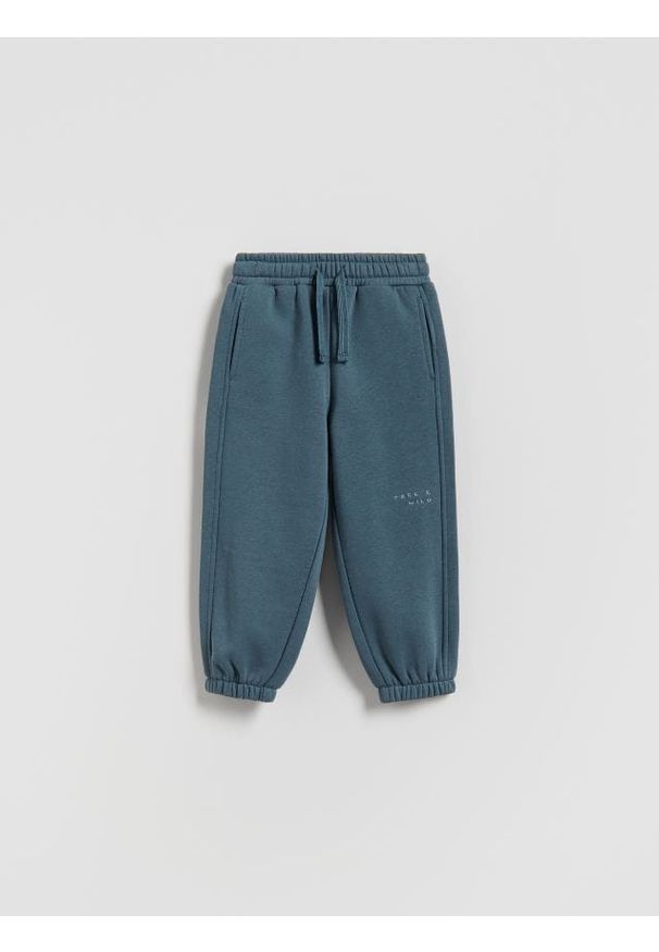 Reserved - Ocieplane spodnie jogger - granatowy. Kolor: niebieski. Materiał: dzianina, bawełna