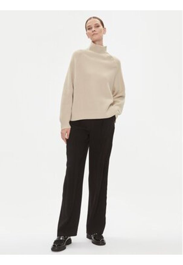 Calvin Klein Golf K20K206014 Beżowy Relaxed Fit. Typ kołnierza: golf. Kolor: beżowy. Materiał: wełna