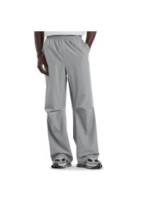 Spodnie męskie New Balance MB61M4DOYST - szare. Kolor: szary. Materiał: materiał, poliester #1