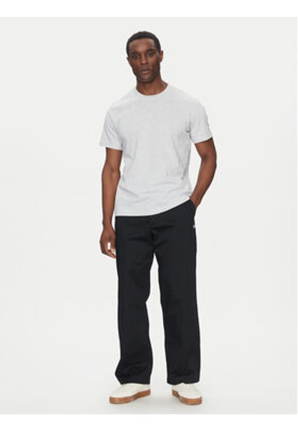 Champion Spodnie materiałowe 220715 Czarny Regular Fit. Kolor: czarny. Materiał: syntetyk