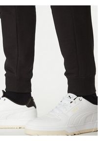 Puma Spodnie dresowe Ess No. 1 Logo 682608 Czarny Regular Fit. Kolor: czarny. Materiał: bawełna, syntetyk