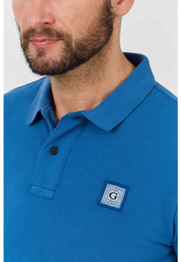 Guess - GUESS Niebieskie męskie polo Washed, Rozmiar XL. Typ kołnierza: polo. Kolor: niebieski