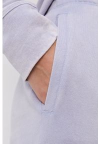DKNY - Dkny Spodnie damskie gładkie. Kolor: niebieski. Materiał: dzianina. Wzór: gładki