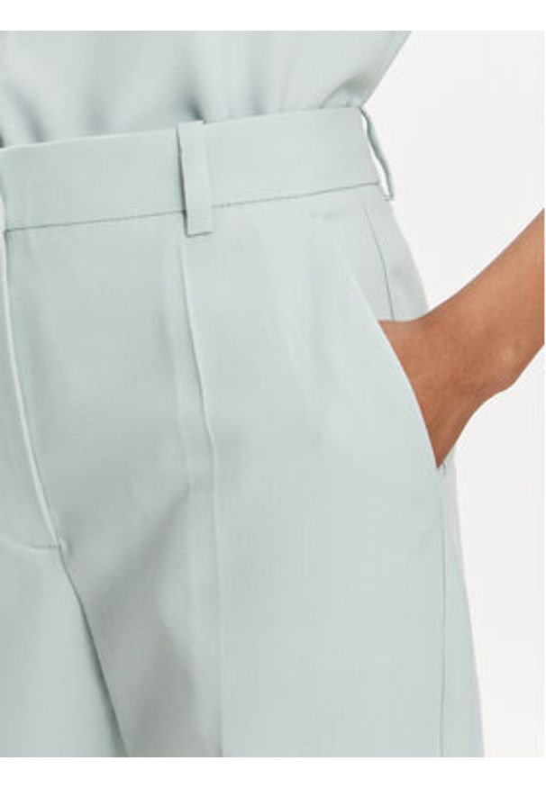 Calvin Klein Chinosy K20K205959 Zielony Slim Fit. Kolor: zielony. Materiał: wiskoza