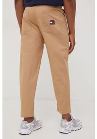 Tommy Jeans spodnie męskie kolor beżowy w fasonie chinos. Kolor: beżowy. Materiał: tkanina, bawełna. Wzór: gładki