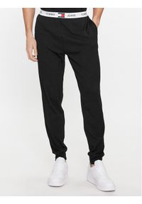 Tommy Jeans Spodnie dresowe UM0UM02962 Czarny Regular Fit. Kolor: czarny. Materiał: bawełna