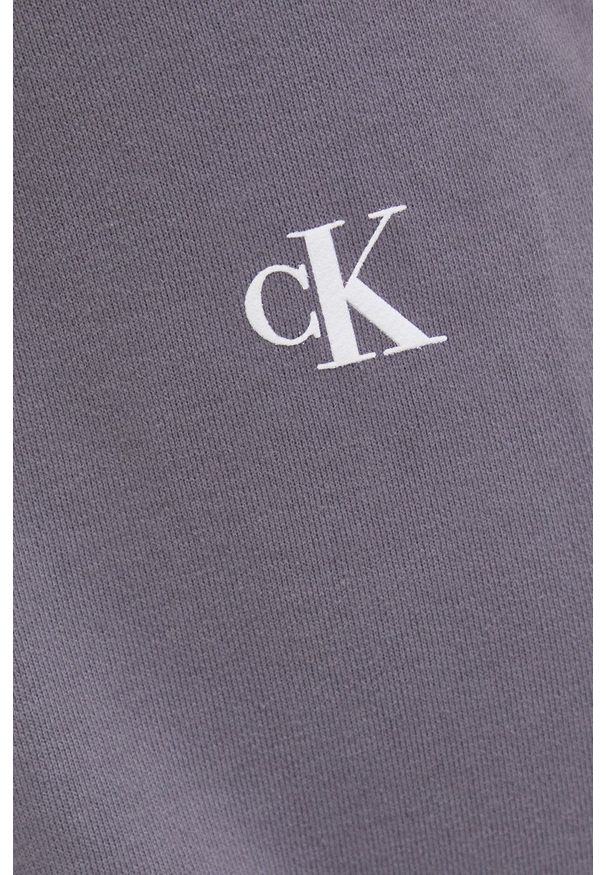Calvin Klein Jeans Spodnie bawełniane damskie kolor szary z nadrukiem. Stan: podwyższony. Kolor: szary. Materiał: bawełna. Wzór: nadruk