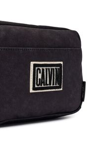 Calvin Klein Saszetka Ssnl Graphic Camera Bag LV04D3628G Czarny. Kolor: czarny. Materiał: materiał #5