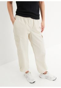 bonprix - Luźniejsze spodnie bojówki z tunelem w dolnej części nogawek. Kolor: beżowy #1